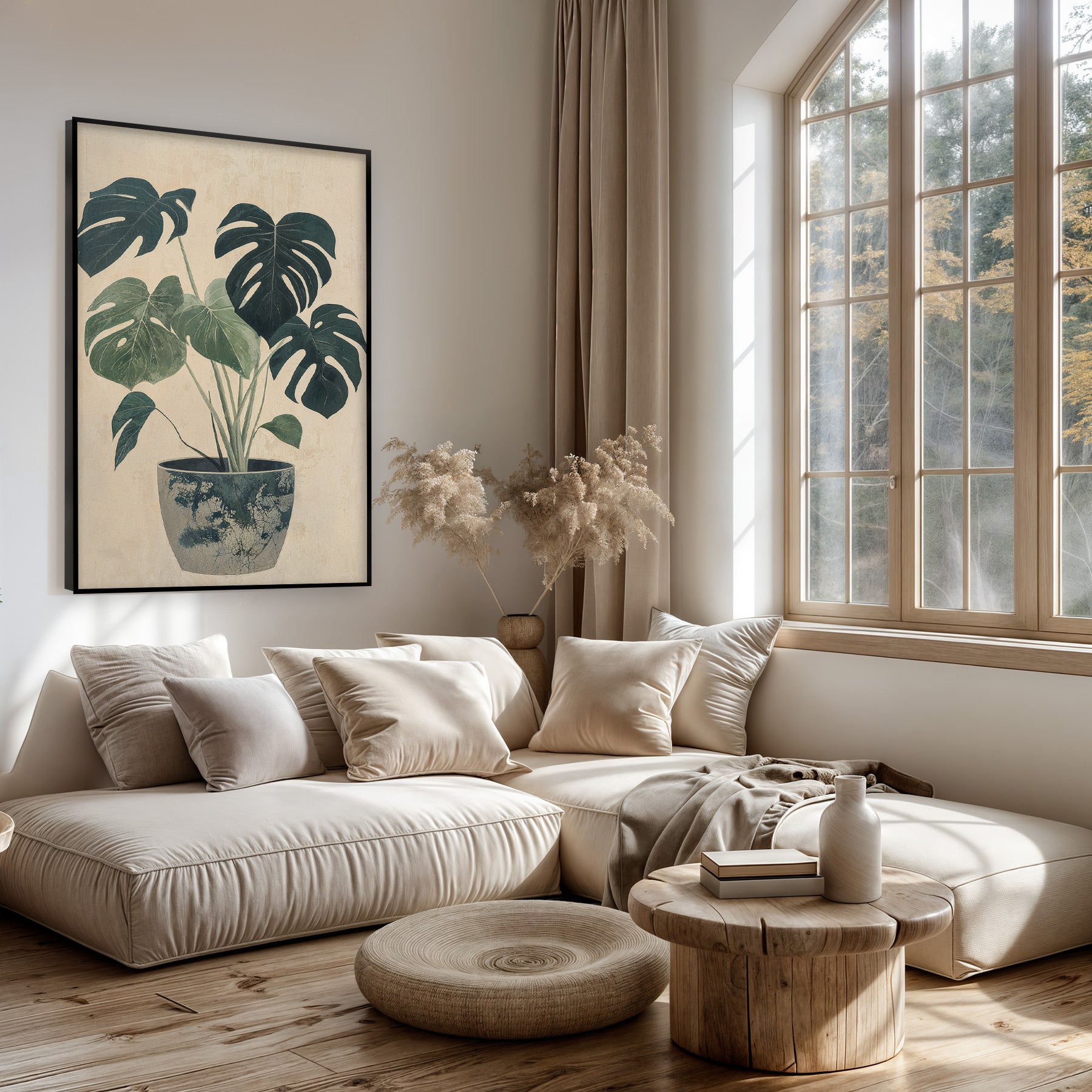 Artframe Monstera boven een lichte bank in een woonkamer.