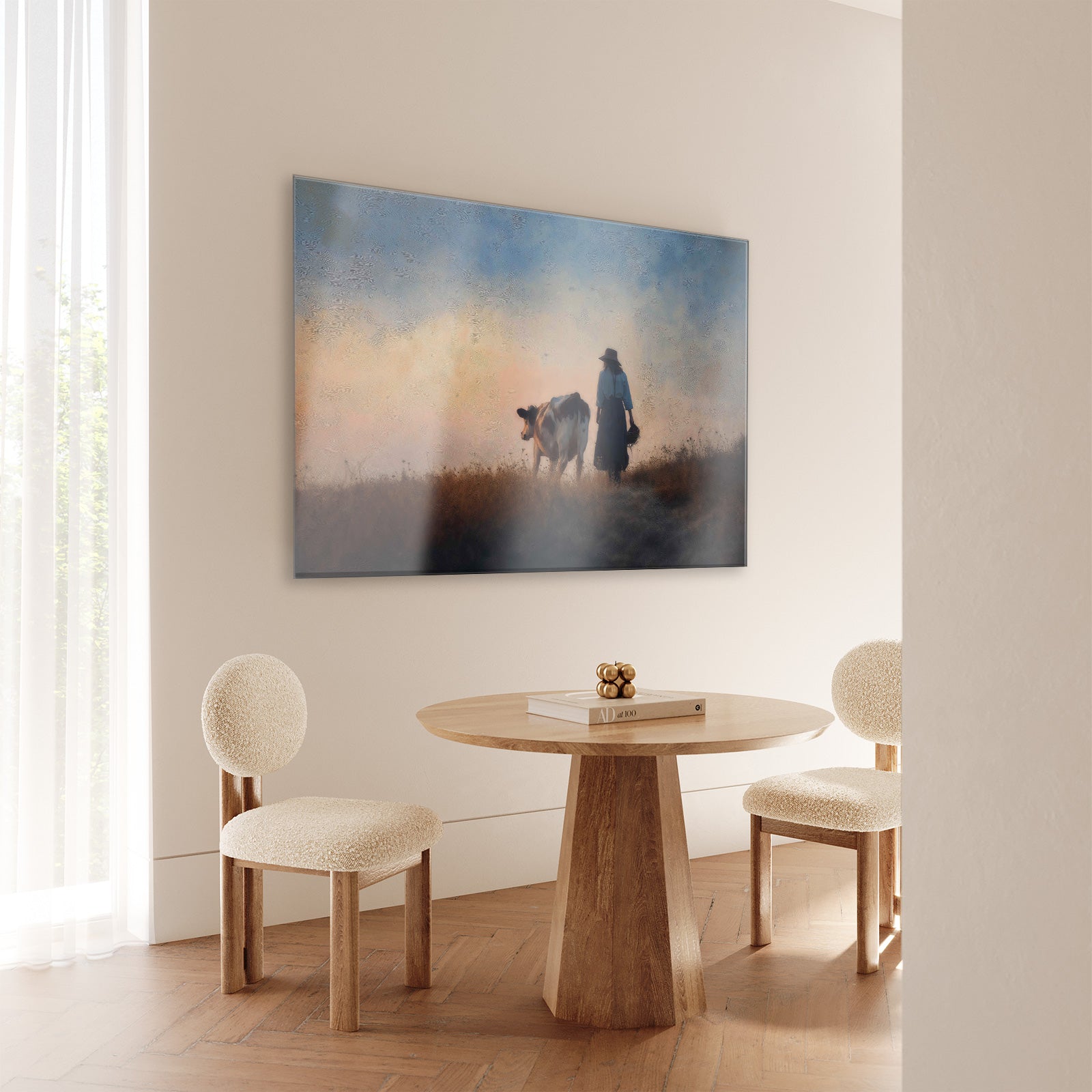 Plexiglas schilderij Meisje en de koe 2 aan de muur bij een ronde houten eettafel.